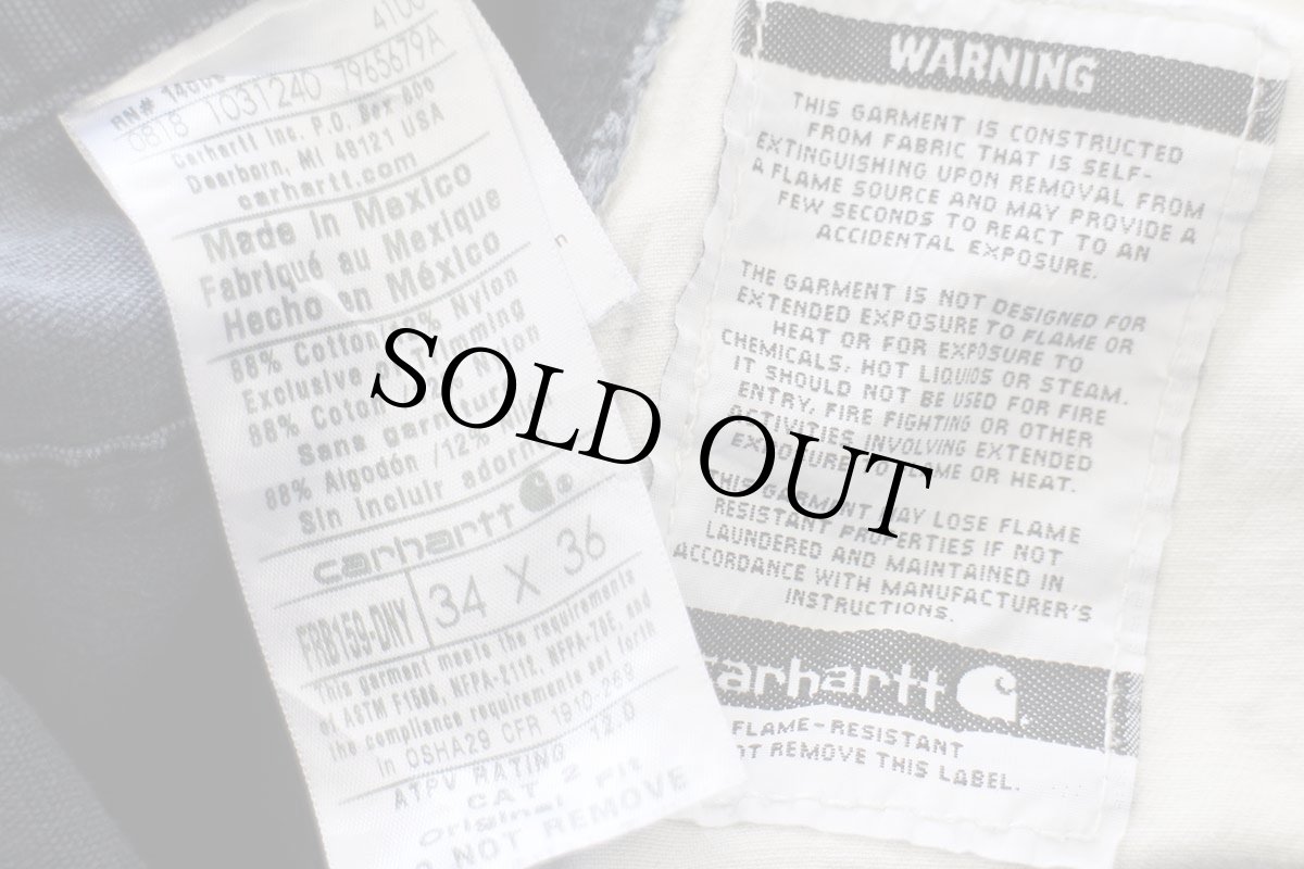 画像8: メキシコ製 carharttカーハート FR CAT2 ペンキ飛び ダック地 ワークパンツ 紺 フェード W34 L36 (8)