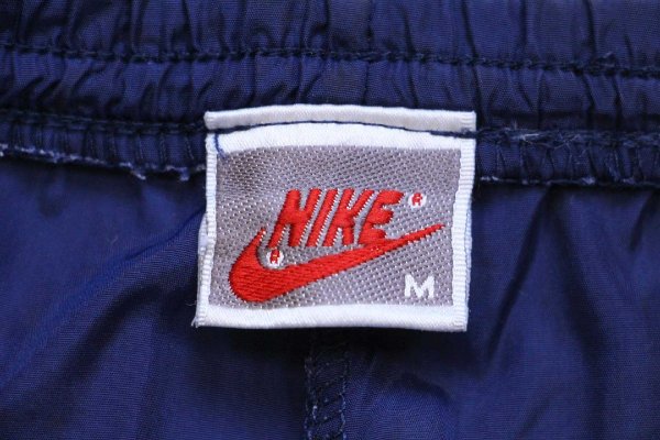 90s NIKEナイキ ワンポイント ナイロンパンツ 紺 M - Sixpacjoe Web Shop